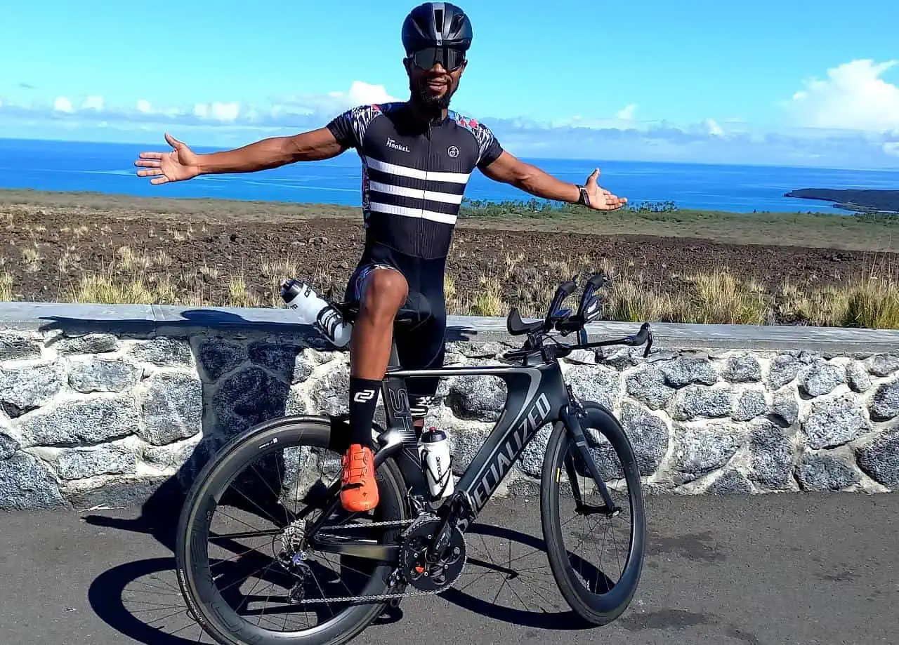 Sanele Shange with his bike overlooking the ocean