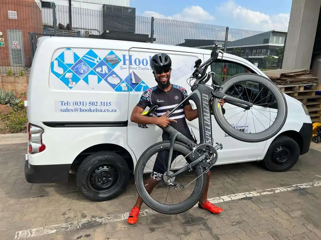Sanele with his bike and Hookei support
